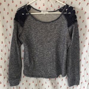 Blue sweater with lace shoulders